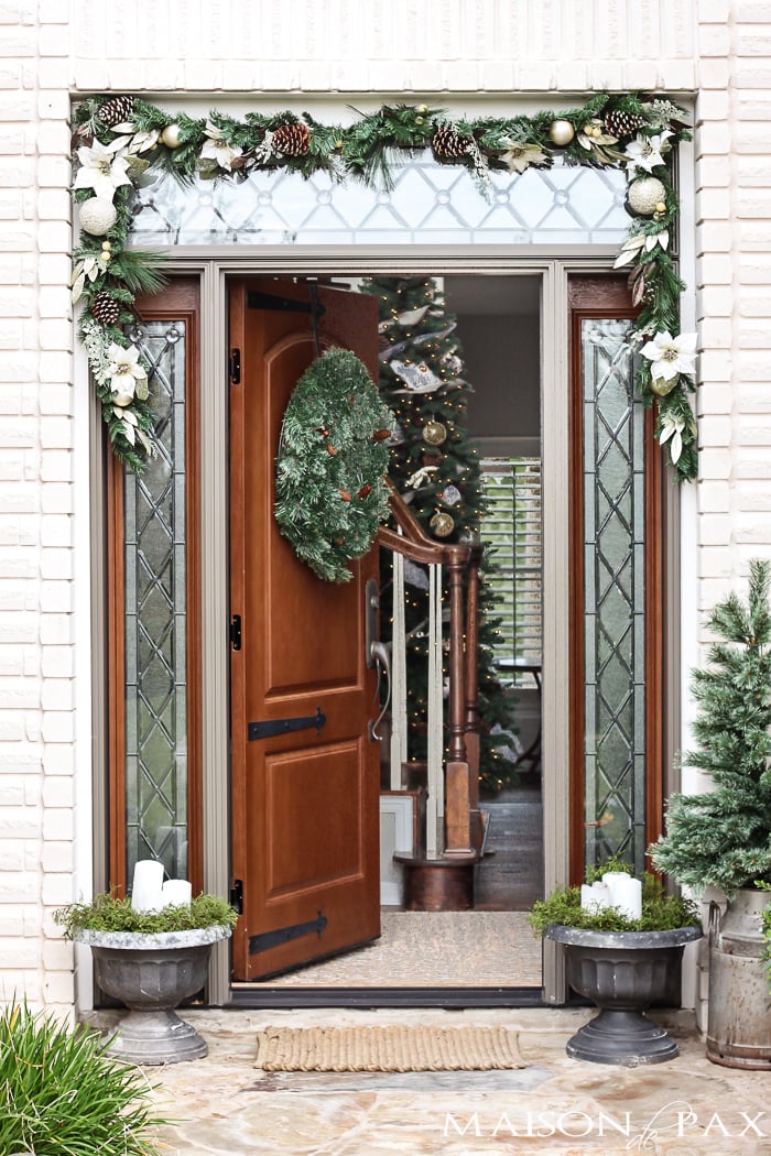I love this simple, white and green look for the holidays! Classic greenery and white accents for a Christmas Front Porch | maisondepax.com