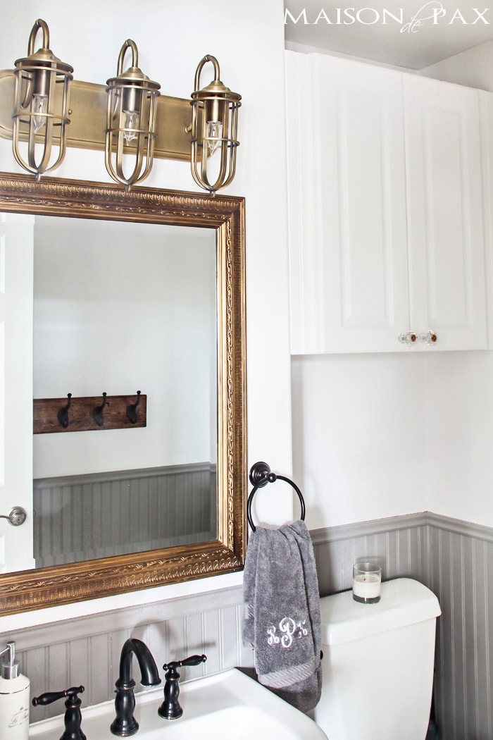 gorgeous rustic, chic bathroom: gold mirror, rustic wood towel rack... perfect balance of high and low | maisondepax.com