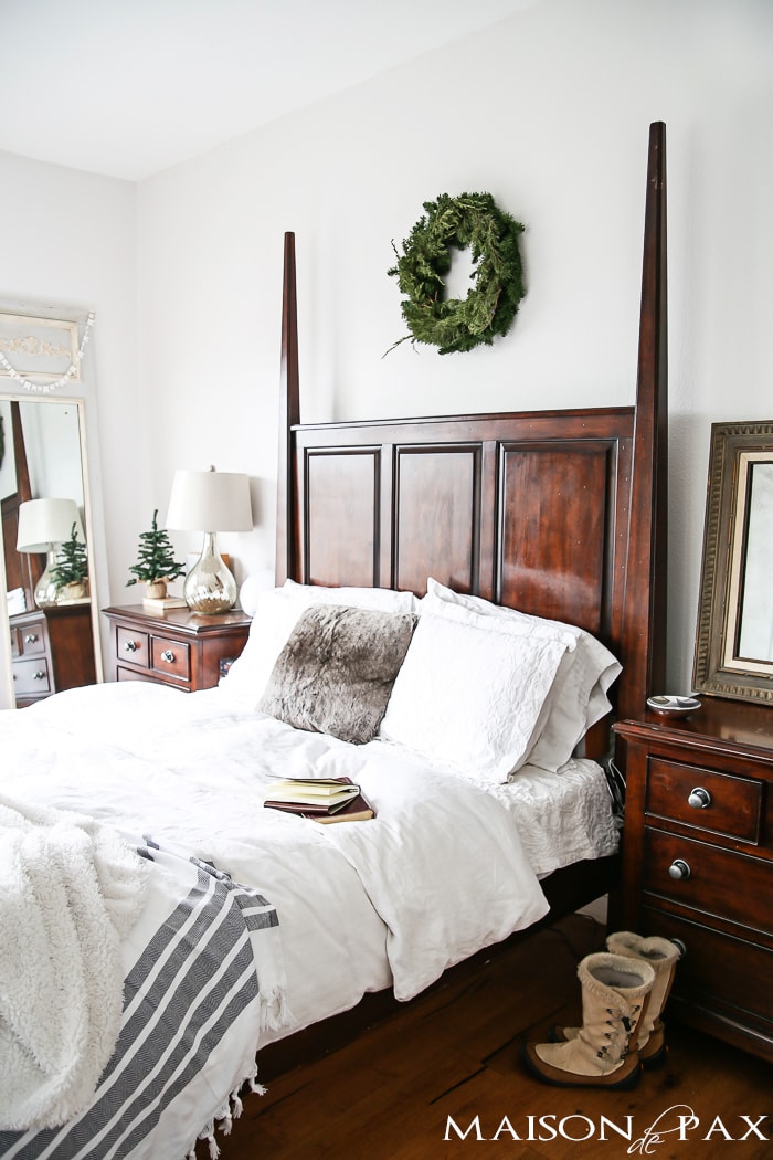 lovely white master bedroom with touches of greenery, warm throws, and texture for winter | maisondepax.com